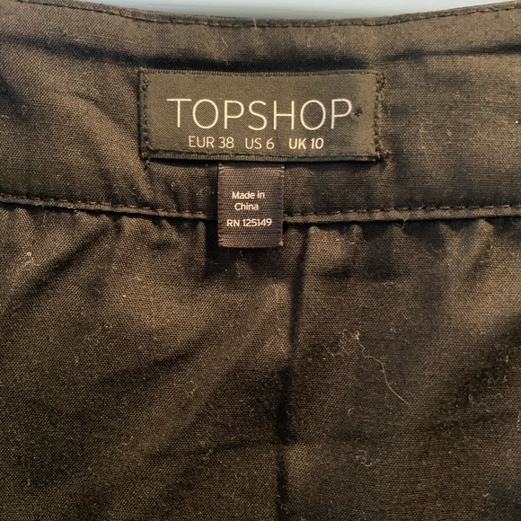 Black “leather” skirt with silver buckling - Picture 5 of 6